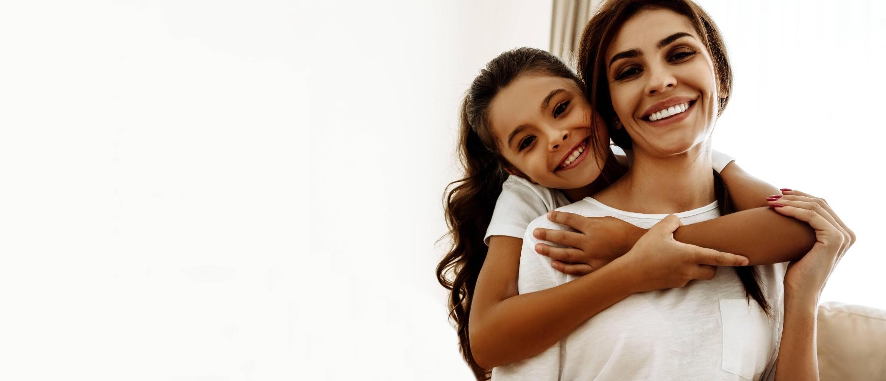 Mother and daughter smiling after family dentistry session in Edmond OK