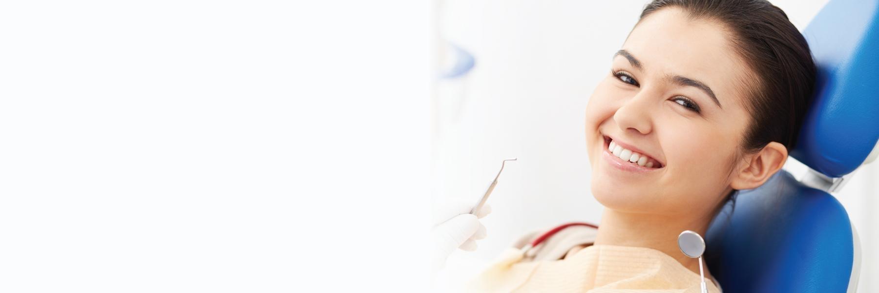 Patient smiling during teeth whitening session in Edmond, OK