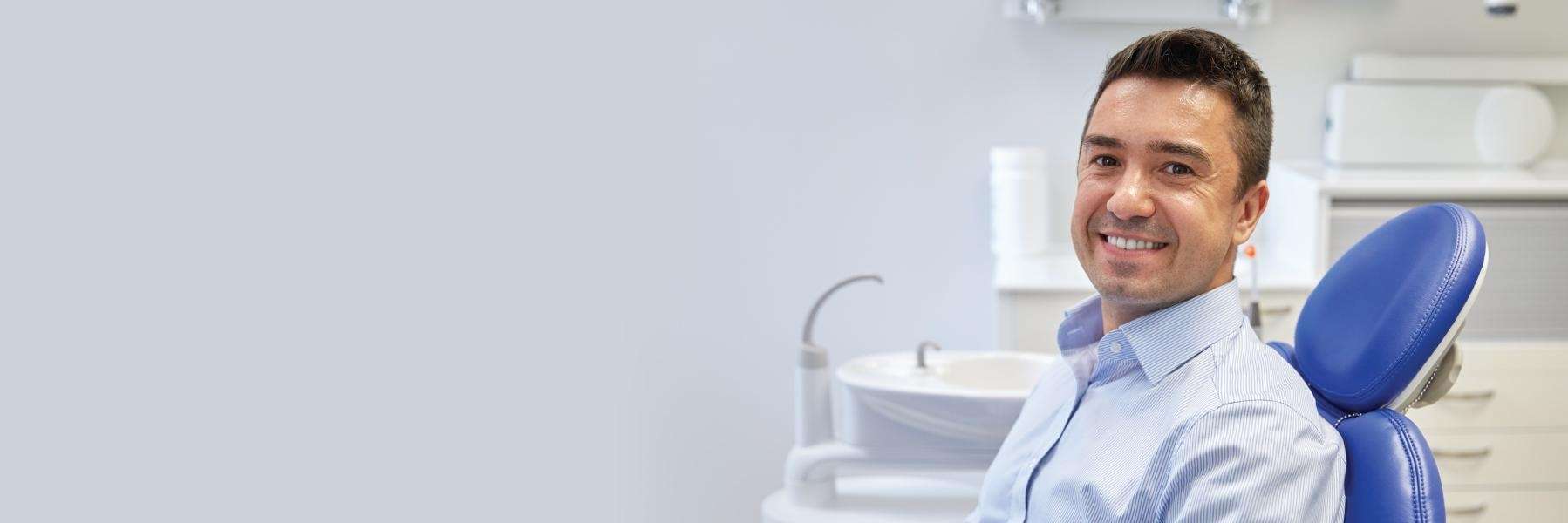 A man smiling after getting dental bridges In Edmond, OK
