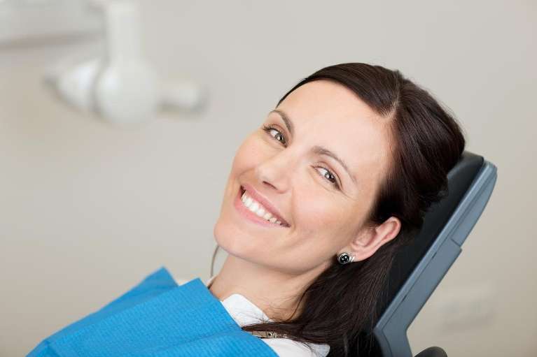 Woman smiling after Root Canal Treatment in Edmond, OK