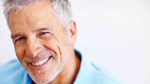 An elderly man smiling after getting Affordable Porcelain Veneers in Edmond, OK