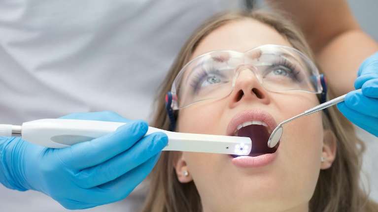 A patient undergoing dental examination at Edmond Dental Center