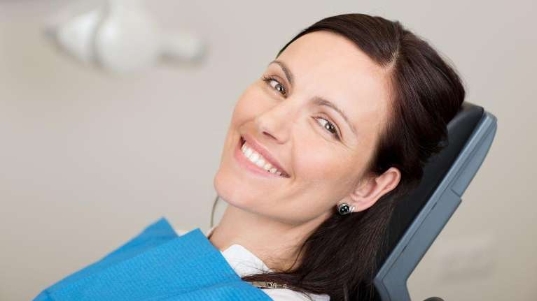 A happy patient after dental check up at Edmund dentist, Edmund OK