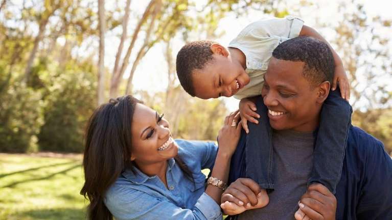 Parent and kid smiling after dental check up at Edmond Dental Center