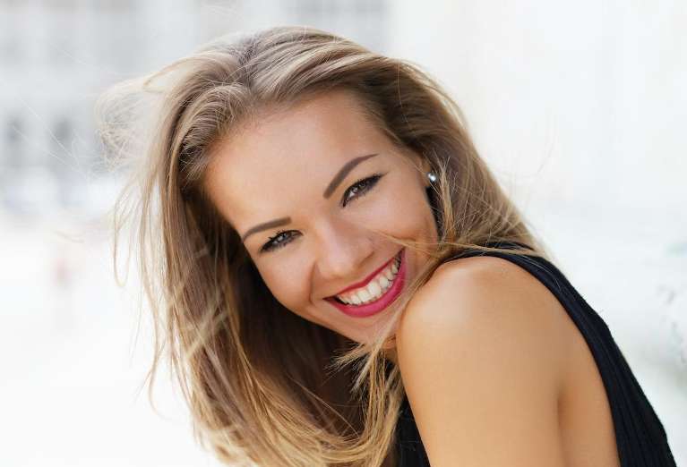  a woman with Same-Day Dental Crowns in Edmond, OK