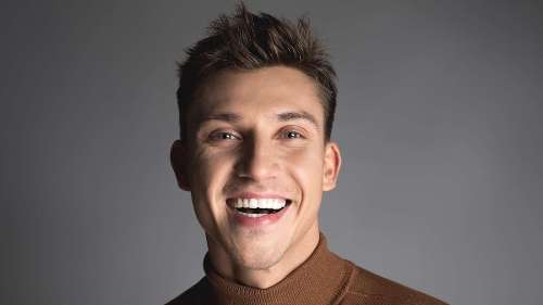 A man smiling after getting a Cosmetic Dentistry treatment in Edmond, OK