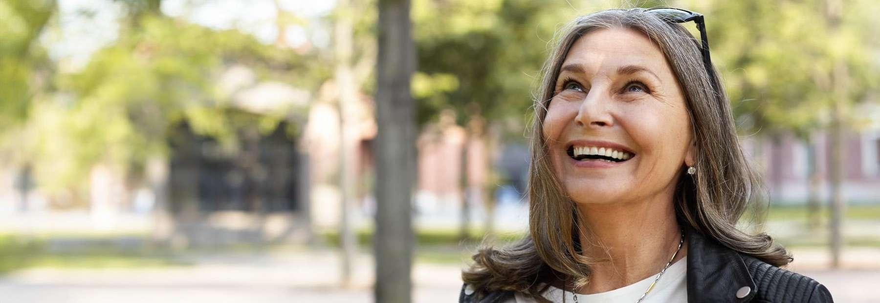 A happy middled aged woman after root canal treatment in Edmond, OK