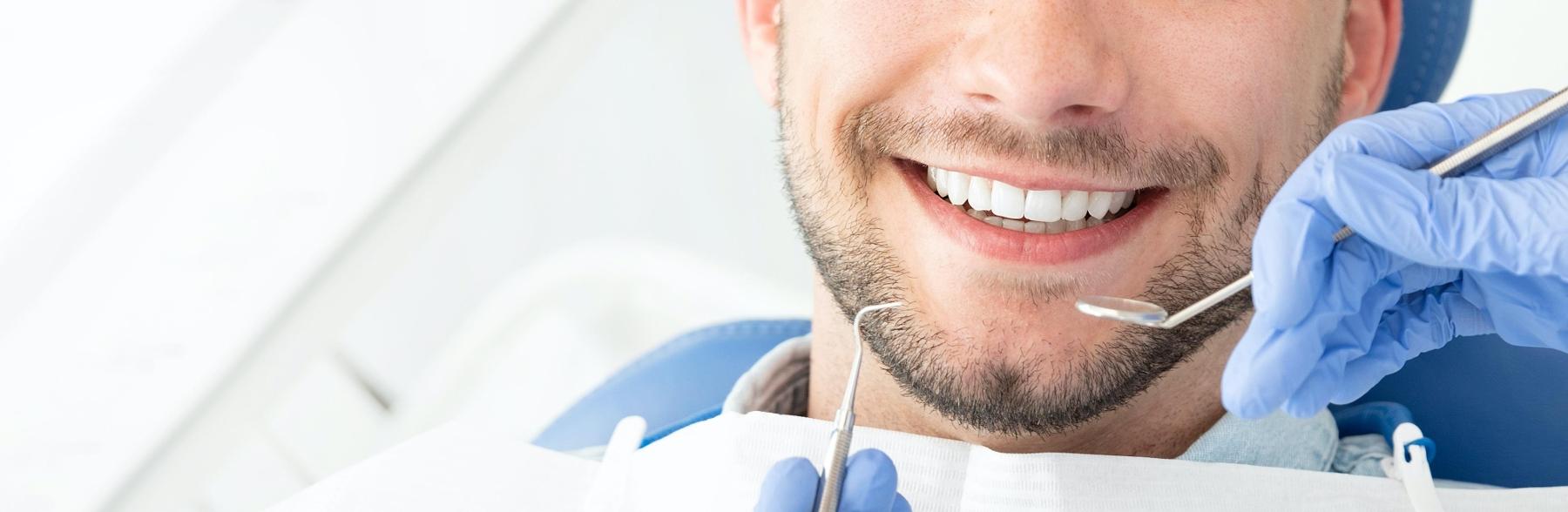 Patient smiling before sedation to undergo dental implant surgery Edmond Dental Center