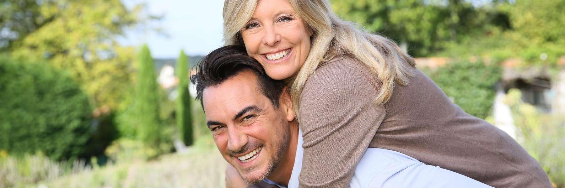 Couple smiling after dental treatment in Edmond, OK