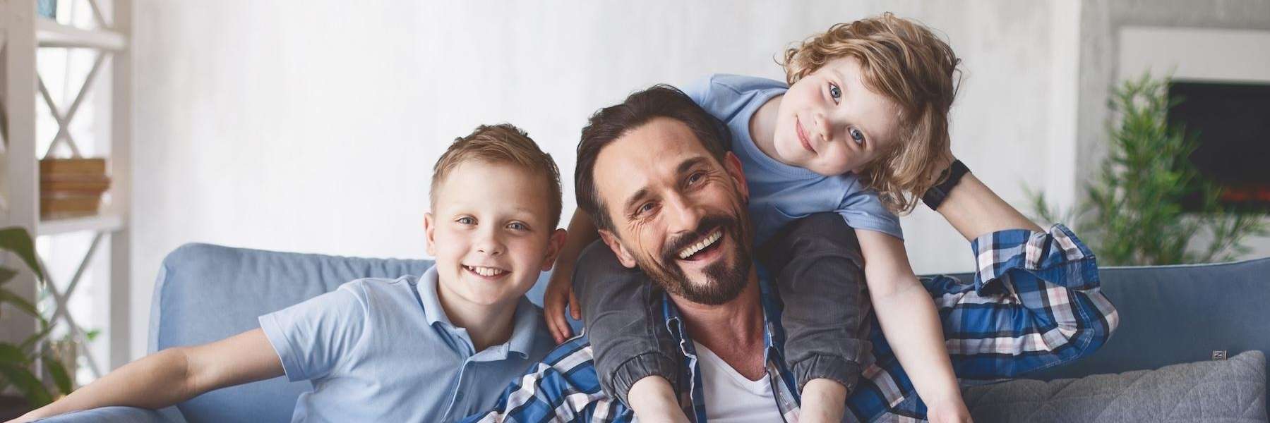 Father and kids relaxing after dental examination at Edmond Dental Center