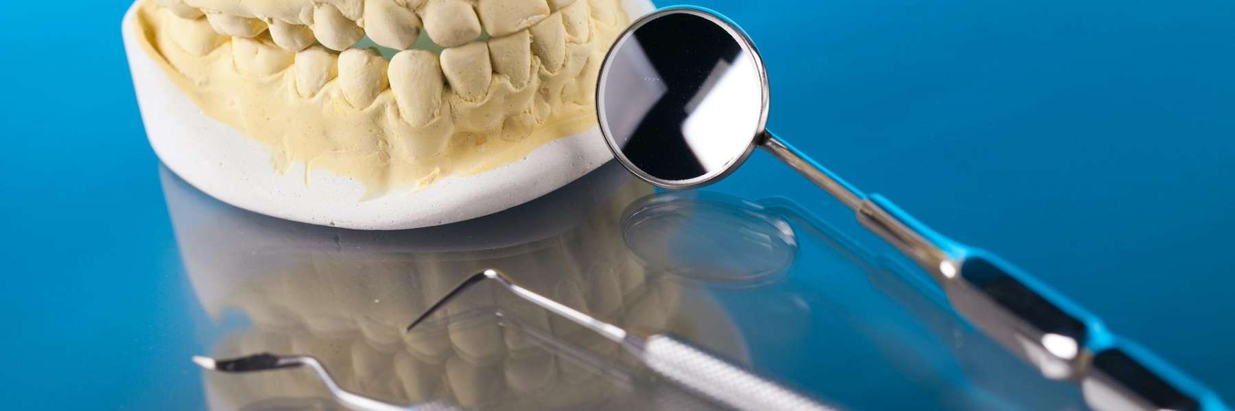 A dental mould and Urgent Dental Care tools in Edmond, OK